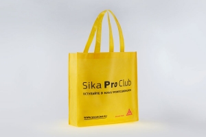 Обьмная промо сумка из желтого спанбонда, логотип шелкографией – черный и красный цвет.